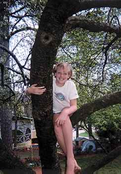 my niece Jordan climbing a tree like a monkey