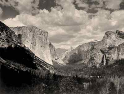 In this view of the Yosemite Valley, El Capitan is to the left, Half Dome is in the distance, and Bridalveil Fall can be seen on the right.