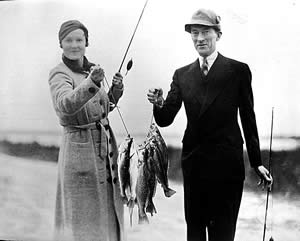 Jimmy Walker, colorful mayor of New York, and Mrs. Walker display their day's catch at the Cloister's fishing dock. Photo courtesy of Sea Island Company.