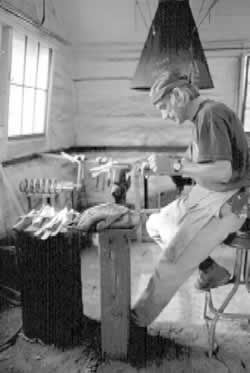 Mountain folk arts have a strong tradition in Western North Carolina and there are many places to witness the fine handicrafts and traditions of the area. Above, a craftsman at the John C. Campbell Folk School in Brasstown, North Carolina.