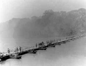 Fort Benning soldiers practicing construction of a pontoon bridge across the Chattahoochee in the 1930s.