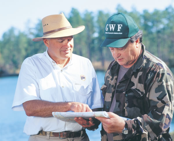 Paul DeLoach and GWF President Jerry McCollum discuss water conservation. Photo by Richard T. Bryant. Email richard_T_bryant@mindspring.com