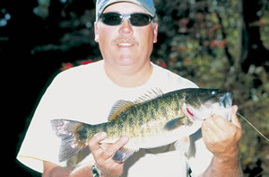 Kyle West proudly holds a prize shoal bass. Photo by Richard T. Bryant. Email richard_T_bryant@mindspring.com