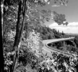 Linn Cove Viaduct, wrapping around Grandfather Mountain, is the most famous feature of the Blue Ridge Parkway in North Carolina and is popular with professional and amateur photographers.